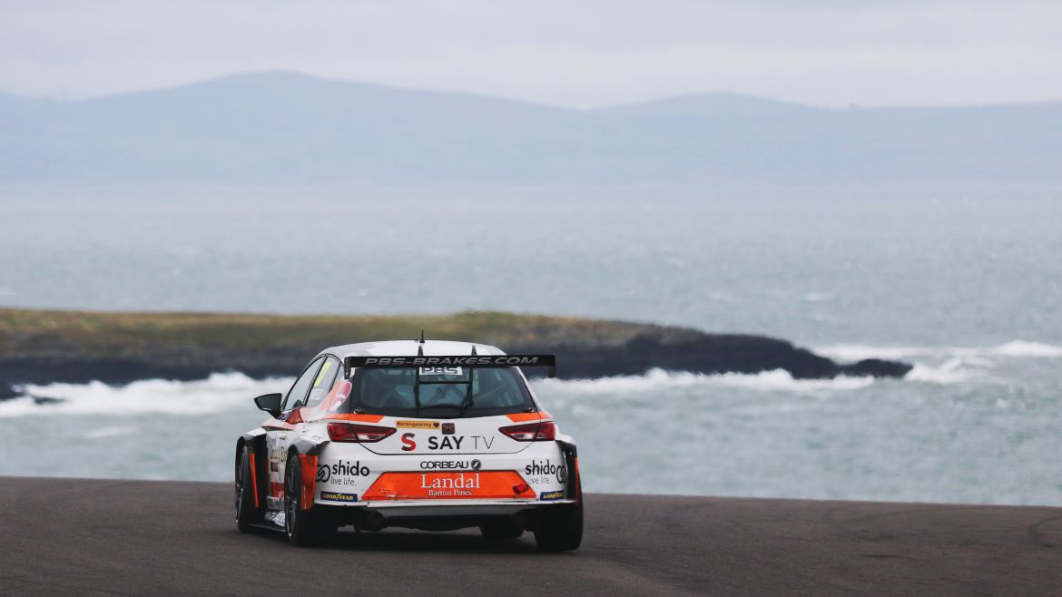 Goodyear Touring Car Trophy action at Anglesey rewards Bruce Winfield with his maiden win and Bradley Kent with his third